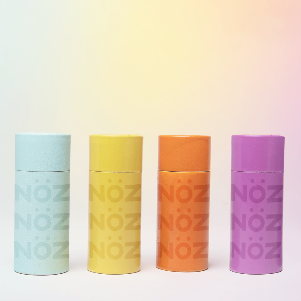 Light blue, yellow, orange, and purple reef-safe and vegan SPF sunscreen